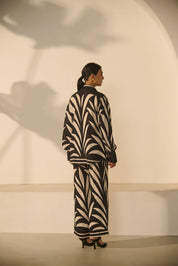 A contemporary black-and-white abstract 
geometric/zebra-style printed Co-ord Set.