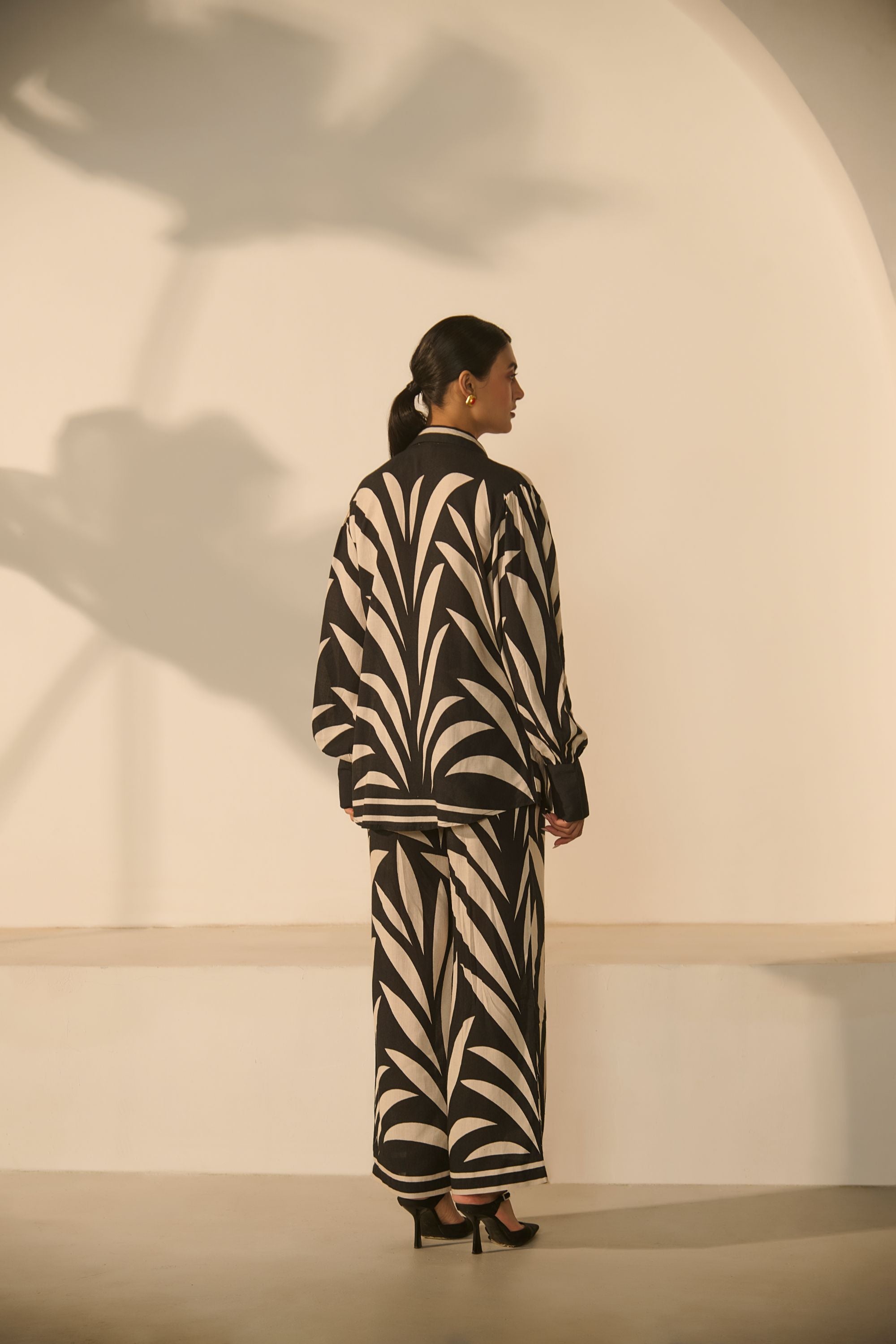 A contemporary black-and-white abstract 
geometric/zebra-style printed Co-ord Set.