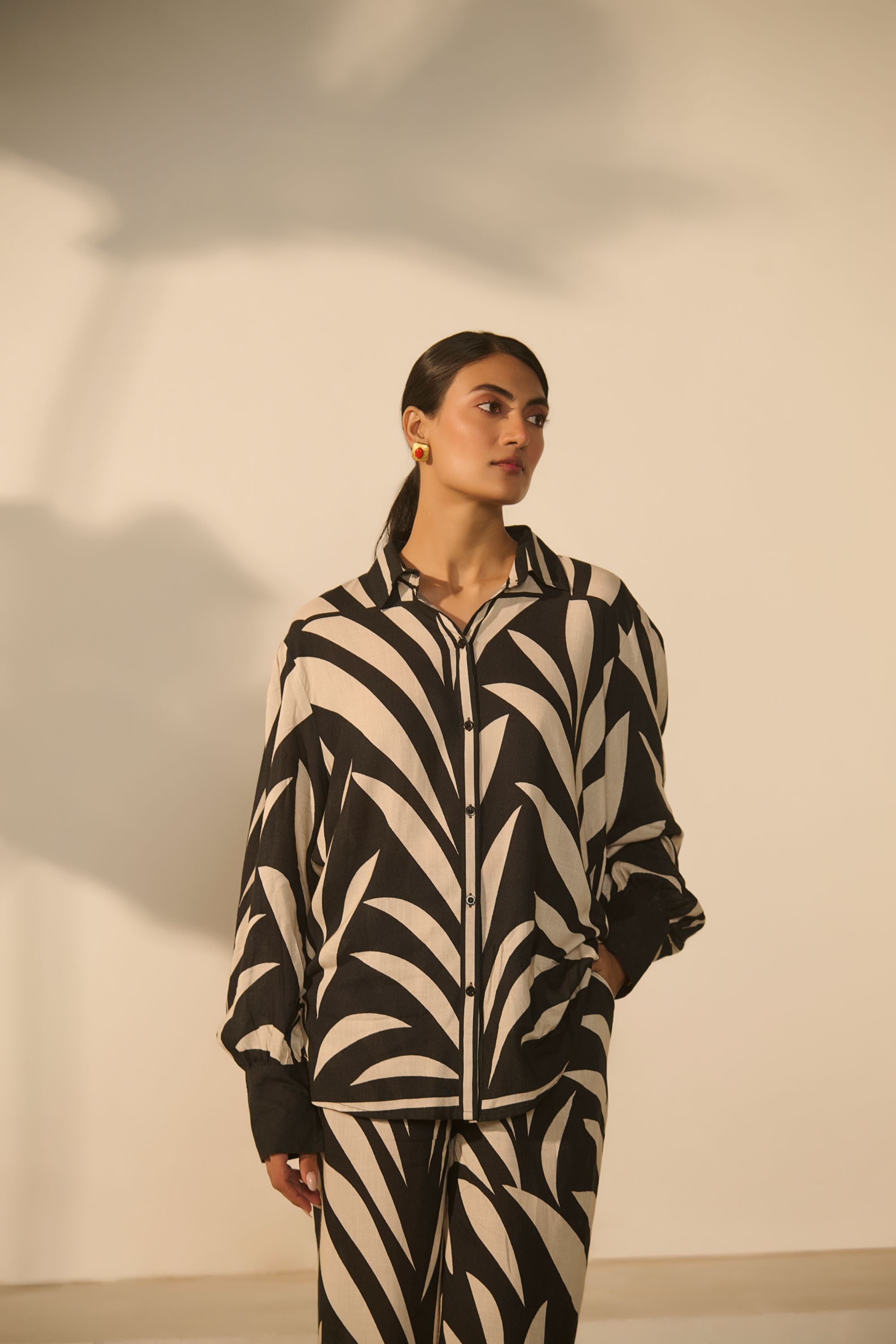 A contemporary black-and-white abstract 
geometric/zebra-style printed Co-ord Set.